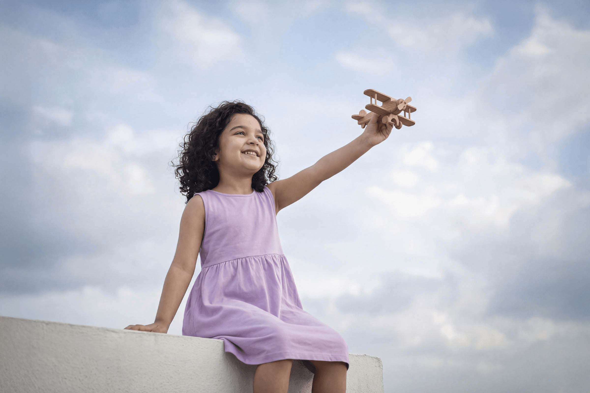 Child with airplane toy